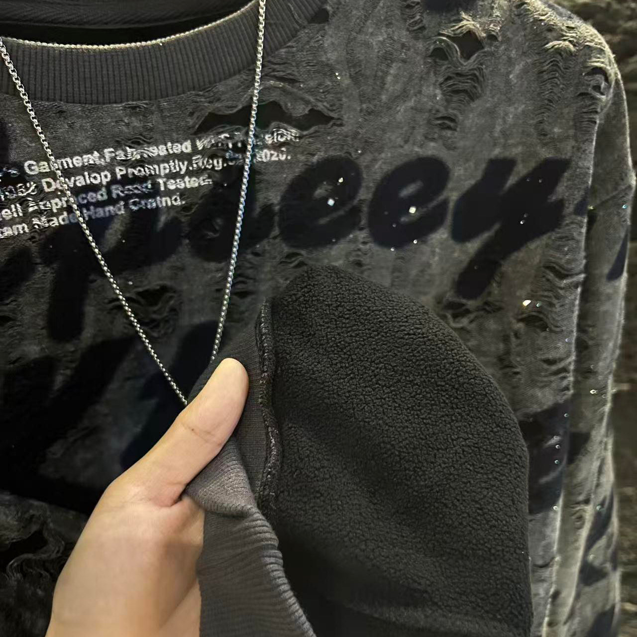 Trendy graffiti lettering ripped sweatshirt